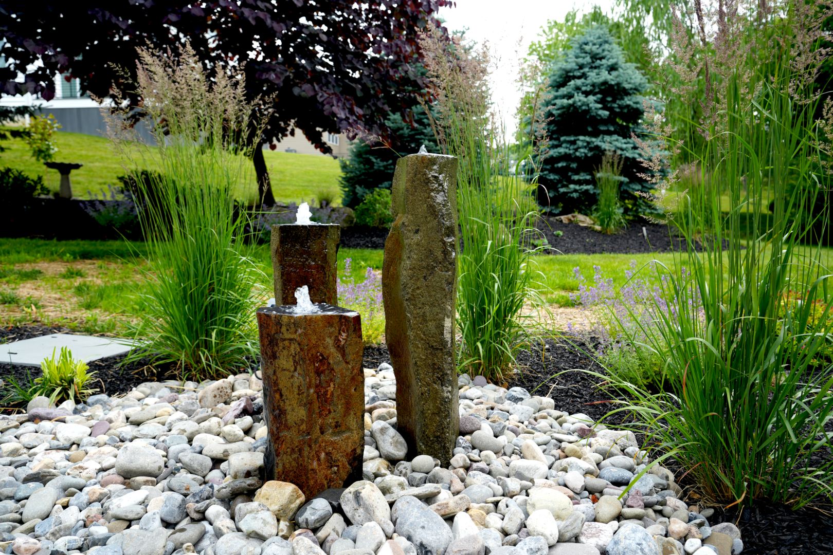 The garden boasts a stunning water fountain as one of its key water features.