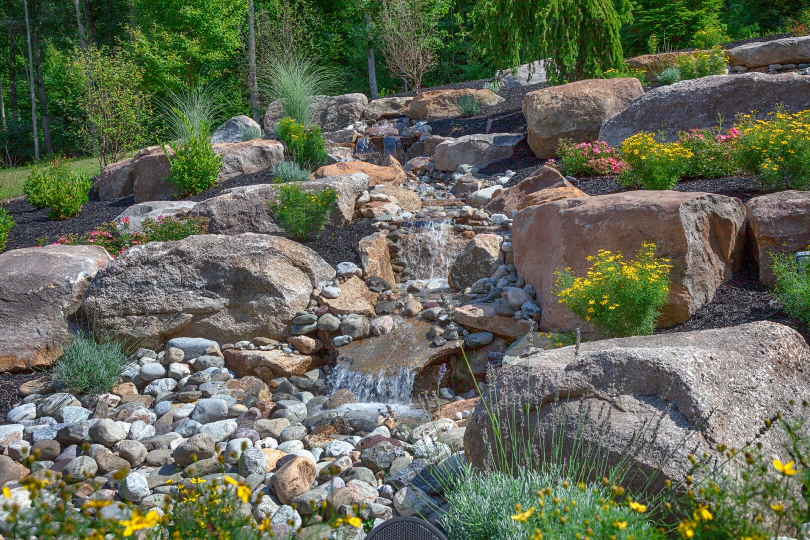 A charming water feature in a rocky area.
