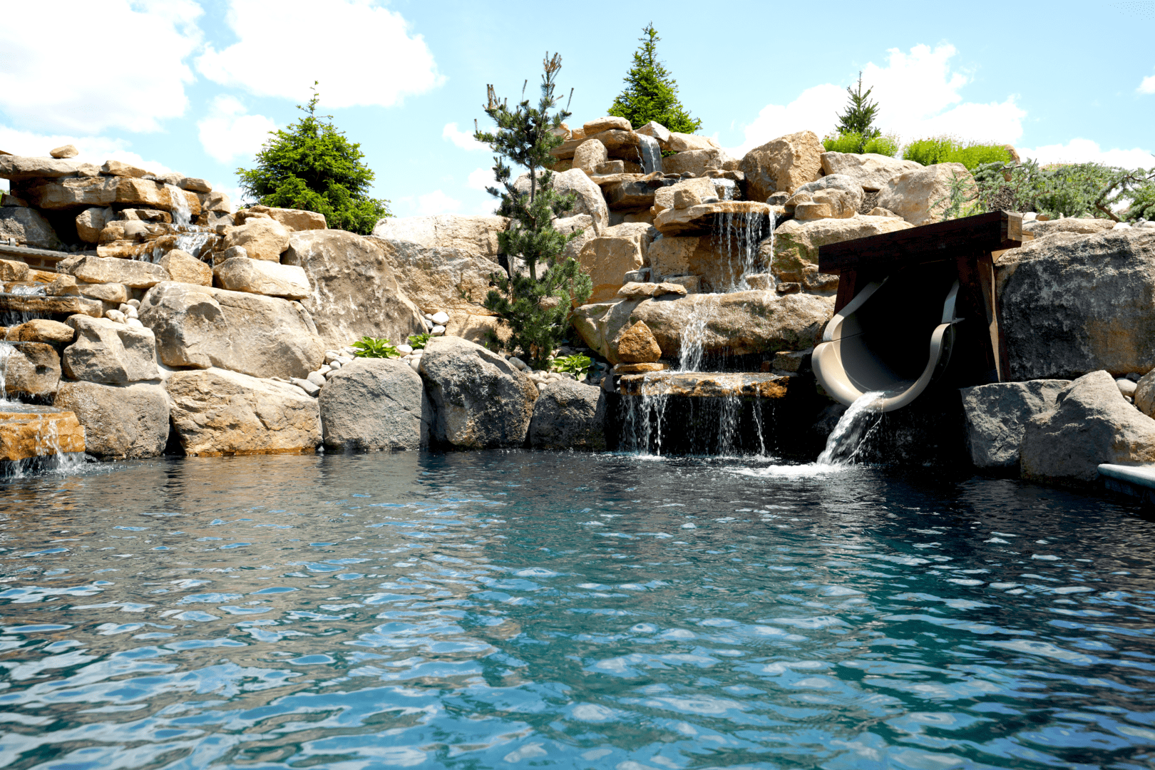 A pool featuring a stunning waterfall.
