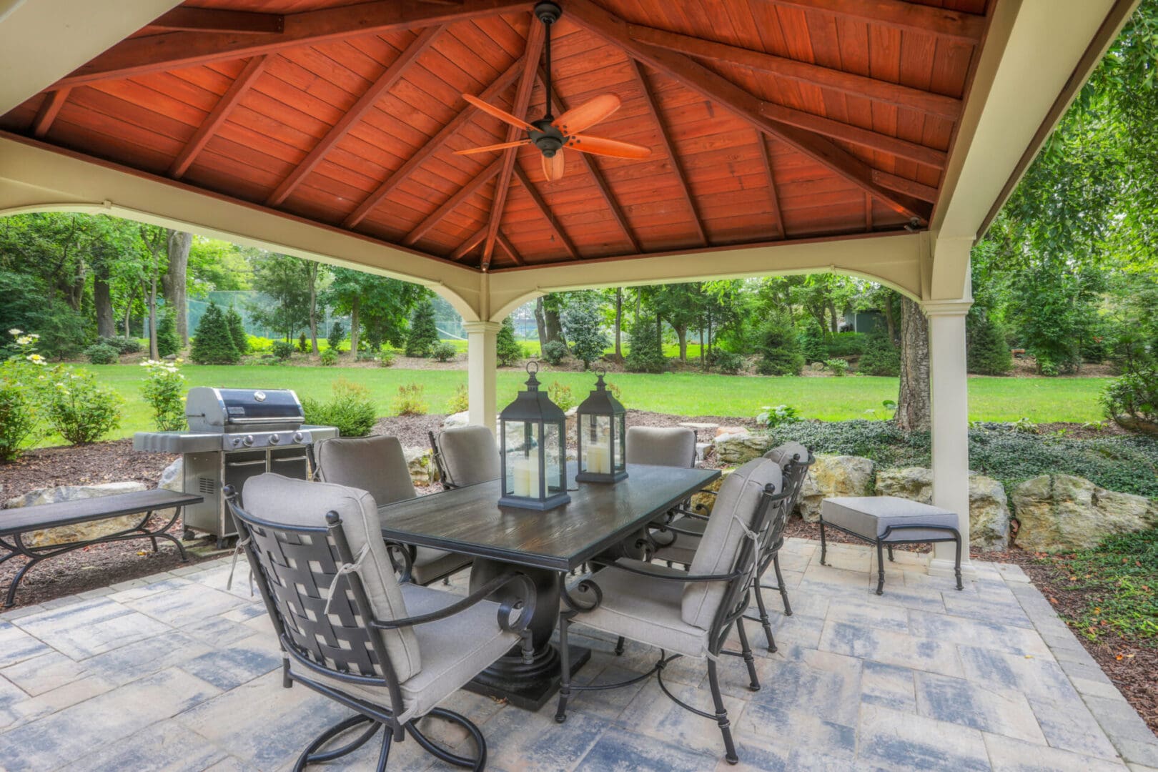 A custom gazebo with a dining table and chairs.