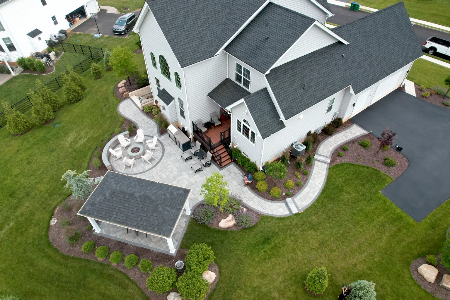 An aerial view showcasing the landscape design of a home with a large backyard.