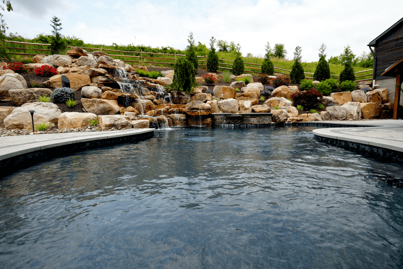 Pool design with a stunning waterfall feature.