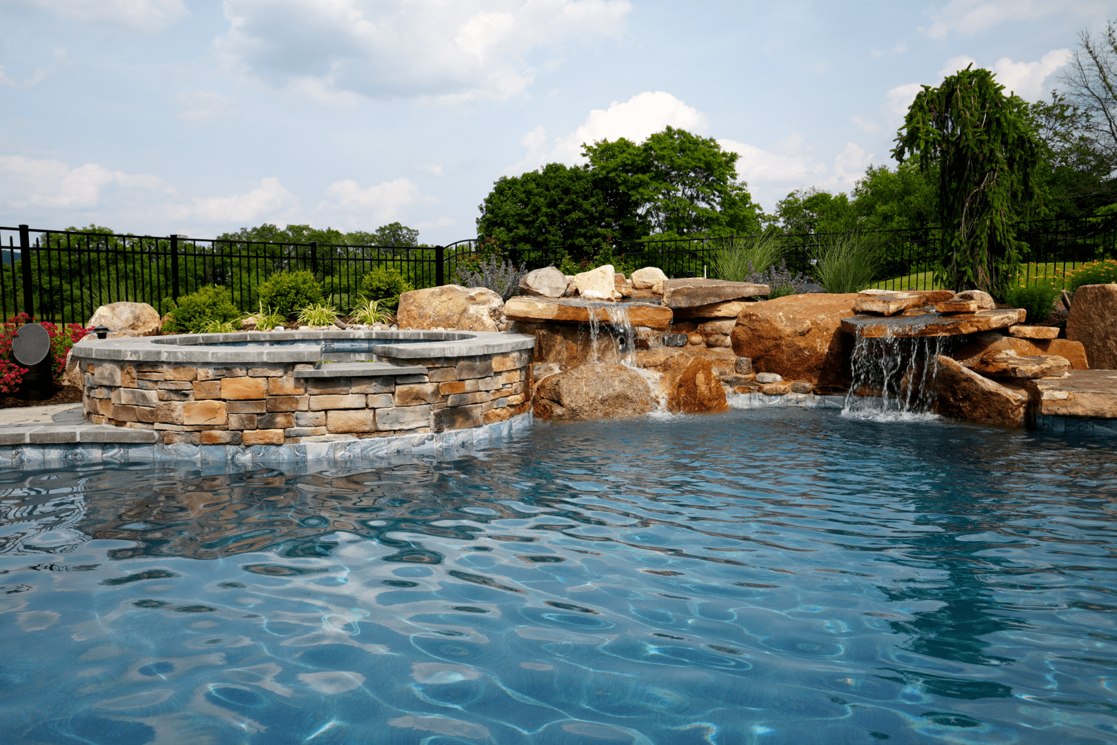 A pool with water features, including a waterfall.