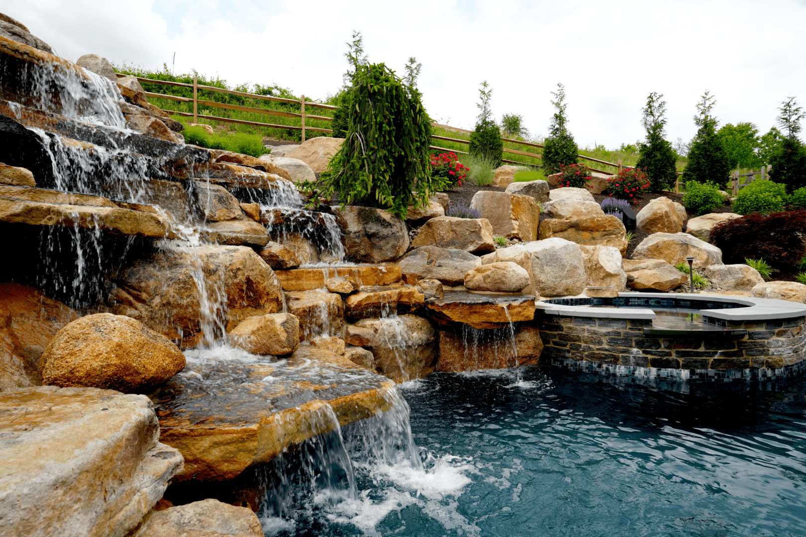 A pool with enchanting water features, including a graceful waterfall.