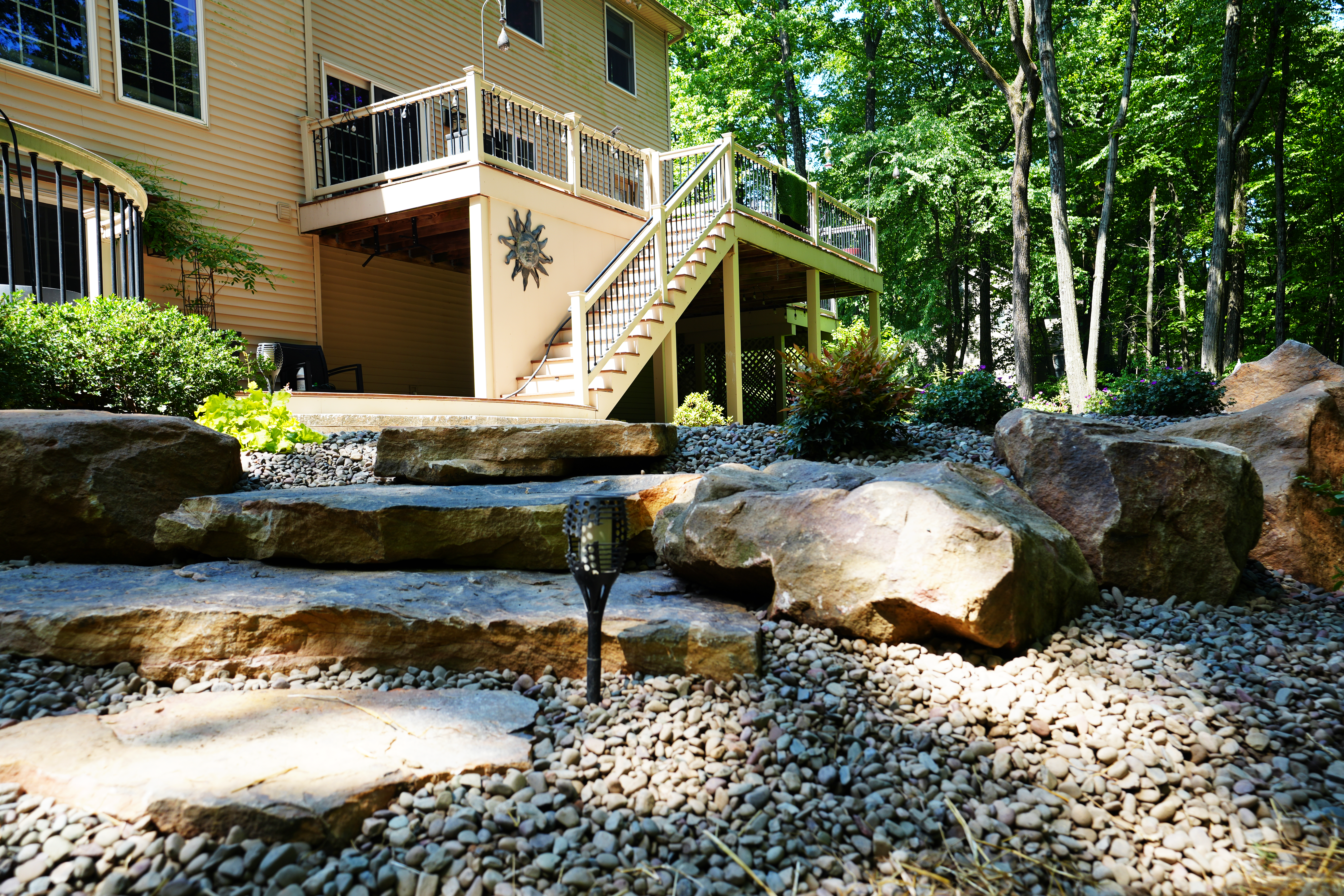 Boulder Step with Landscaping around new patio