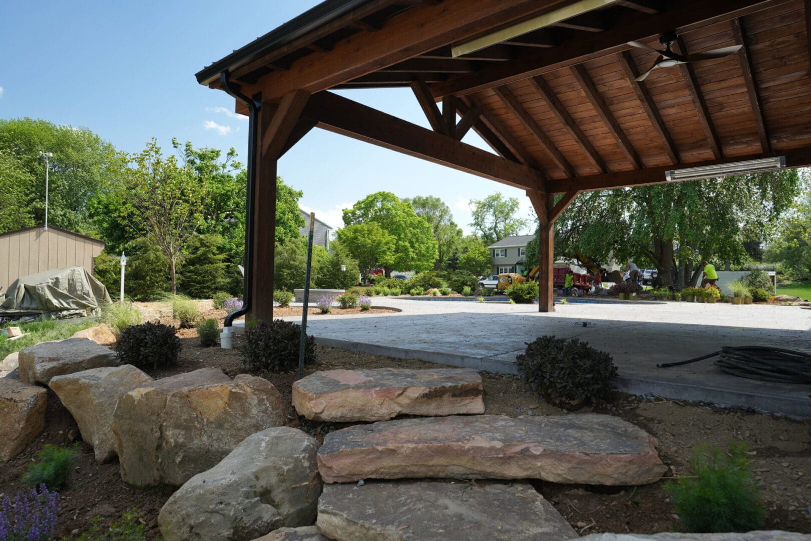 A large stone path leading to an outdoor pavilion.