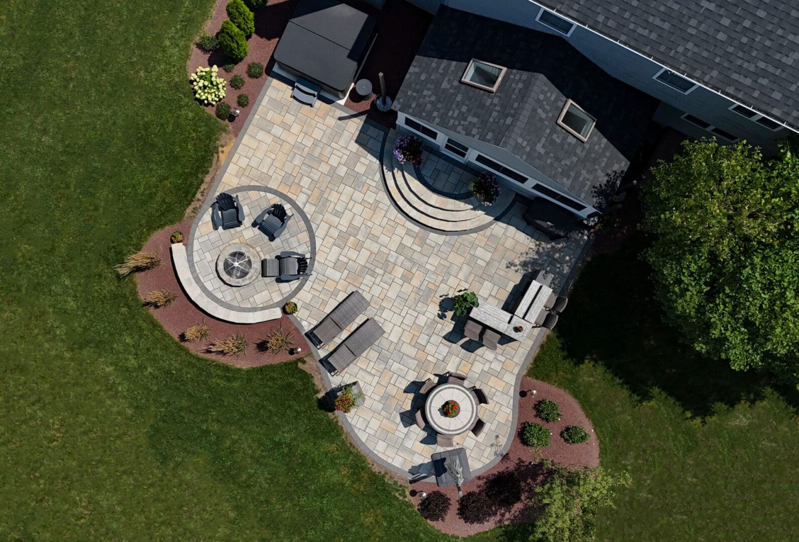 A patio with furniture and fire pit in the middle of an area.