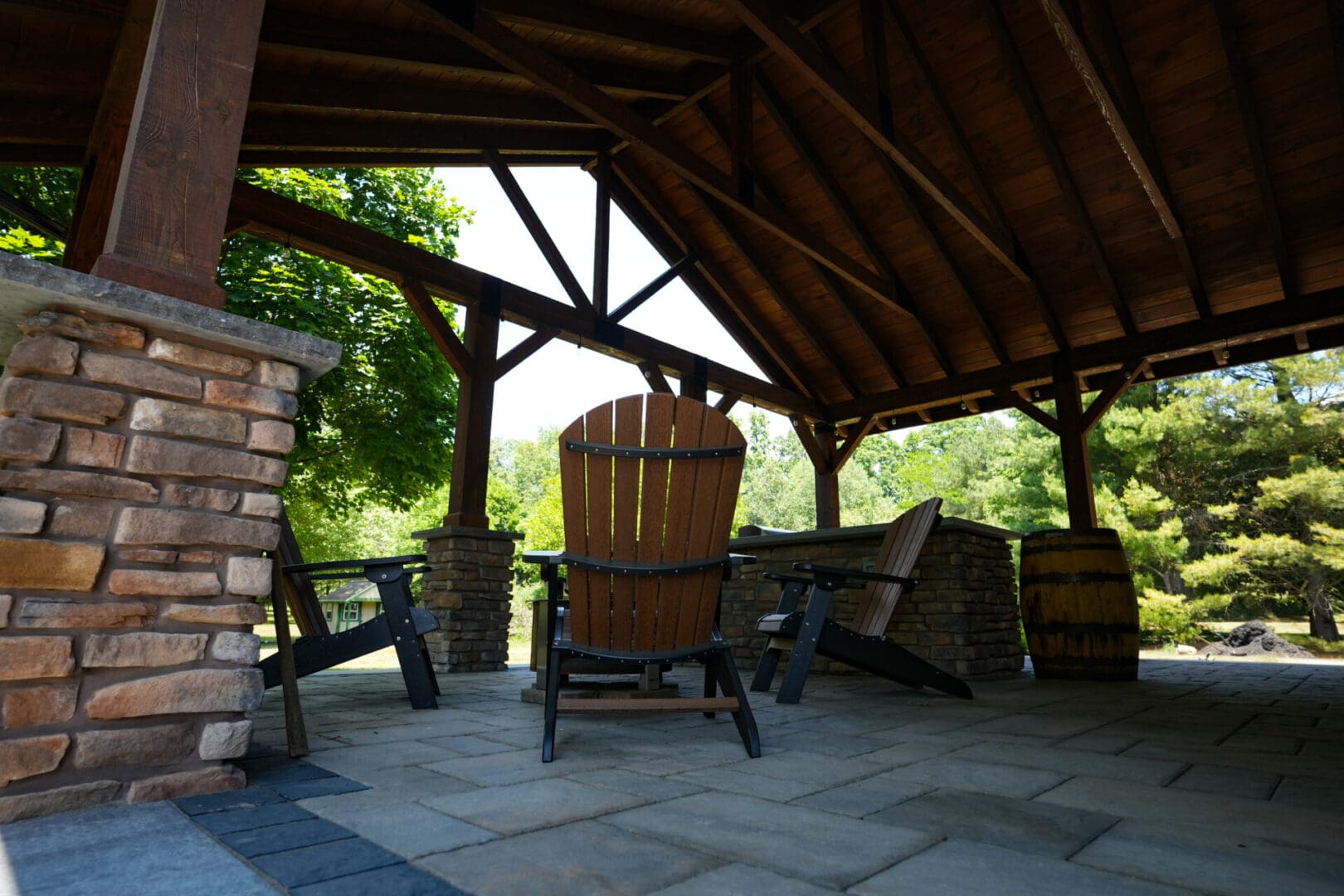 A wooden chair and table in an outdoor setting.