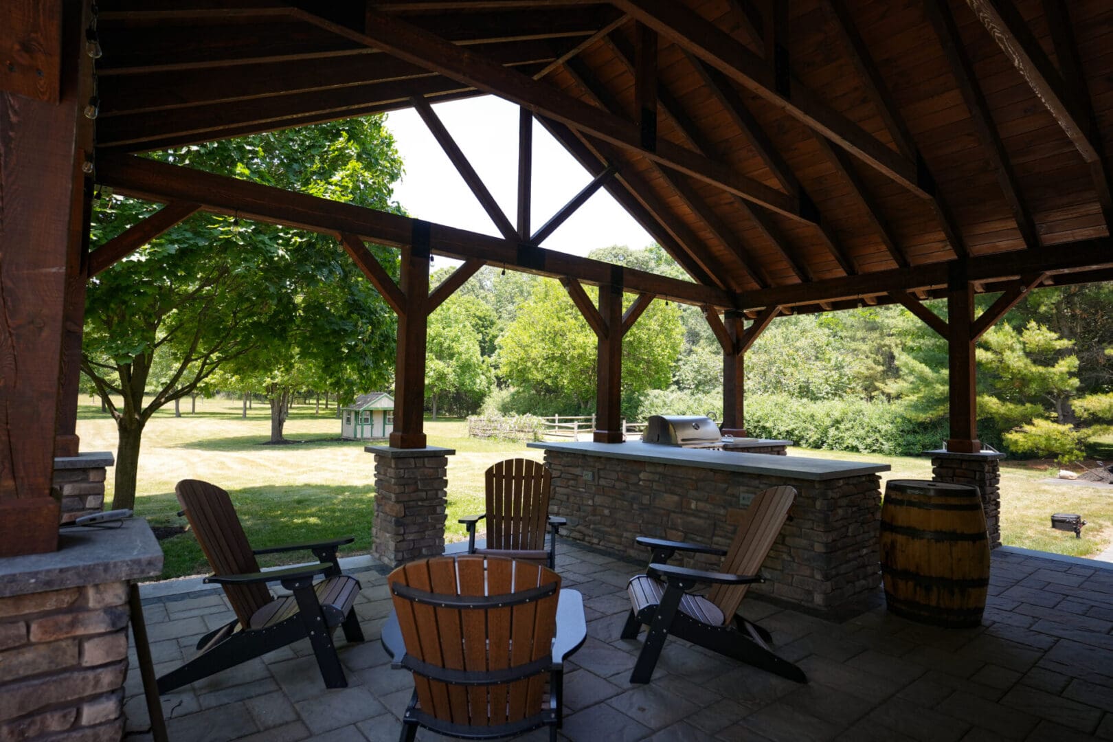 A patio with chairs and an outdoor bar.