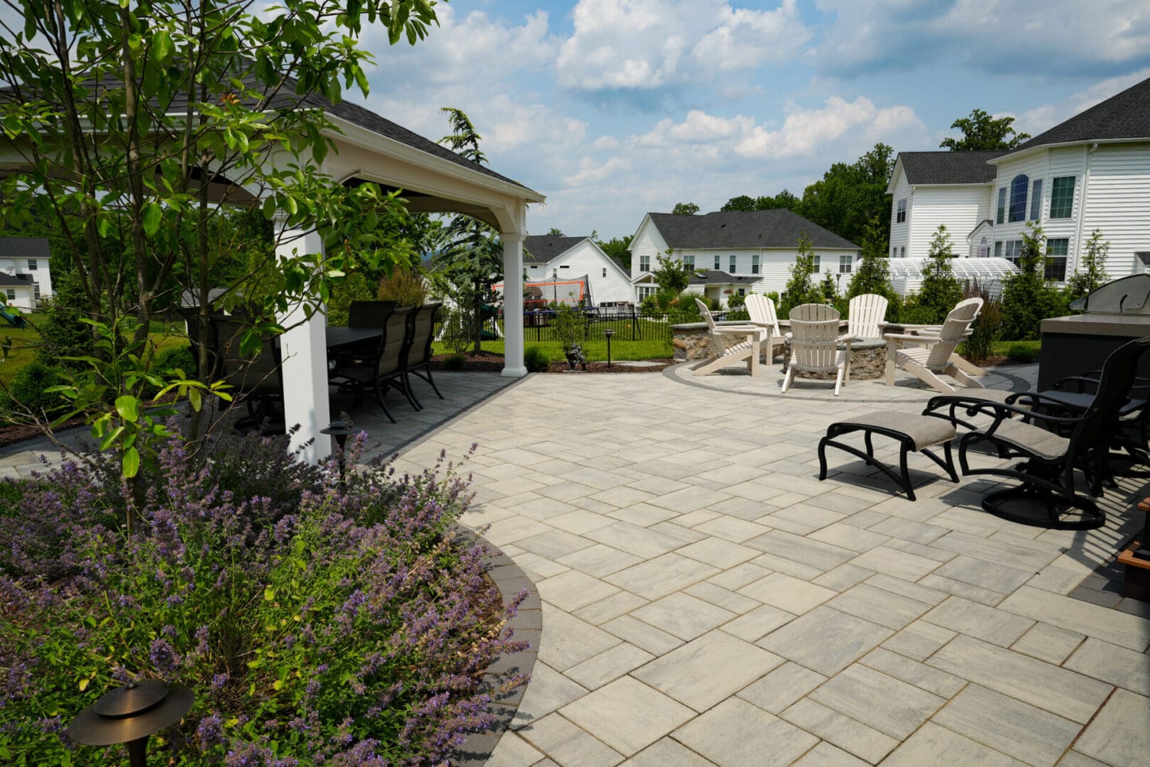 A patio with chairs and tables in it