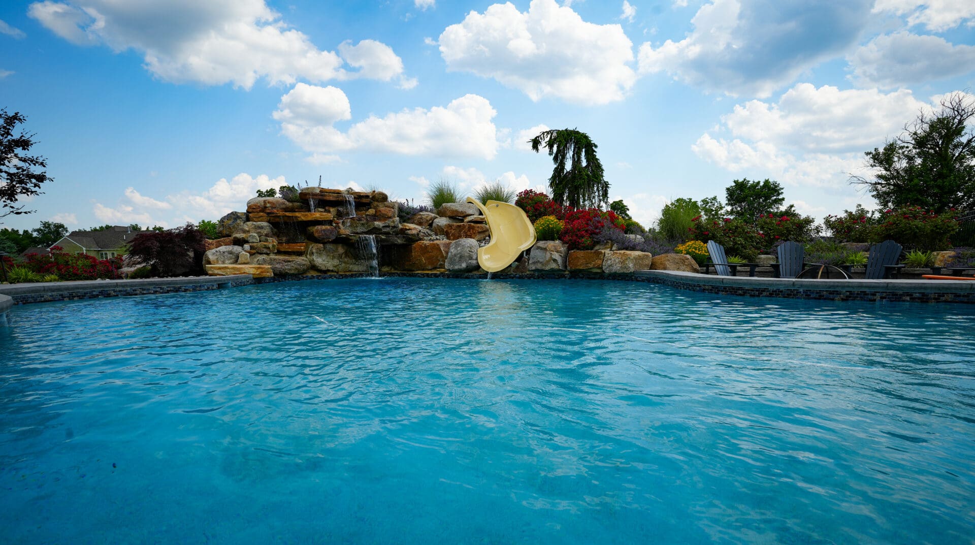 Pool Design with water feature and fire pit