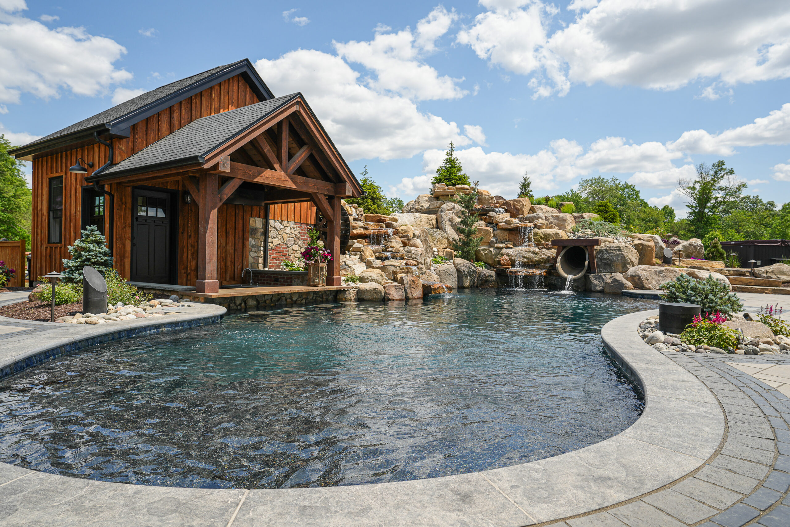 swim up bar, custom pool, waterfalls