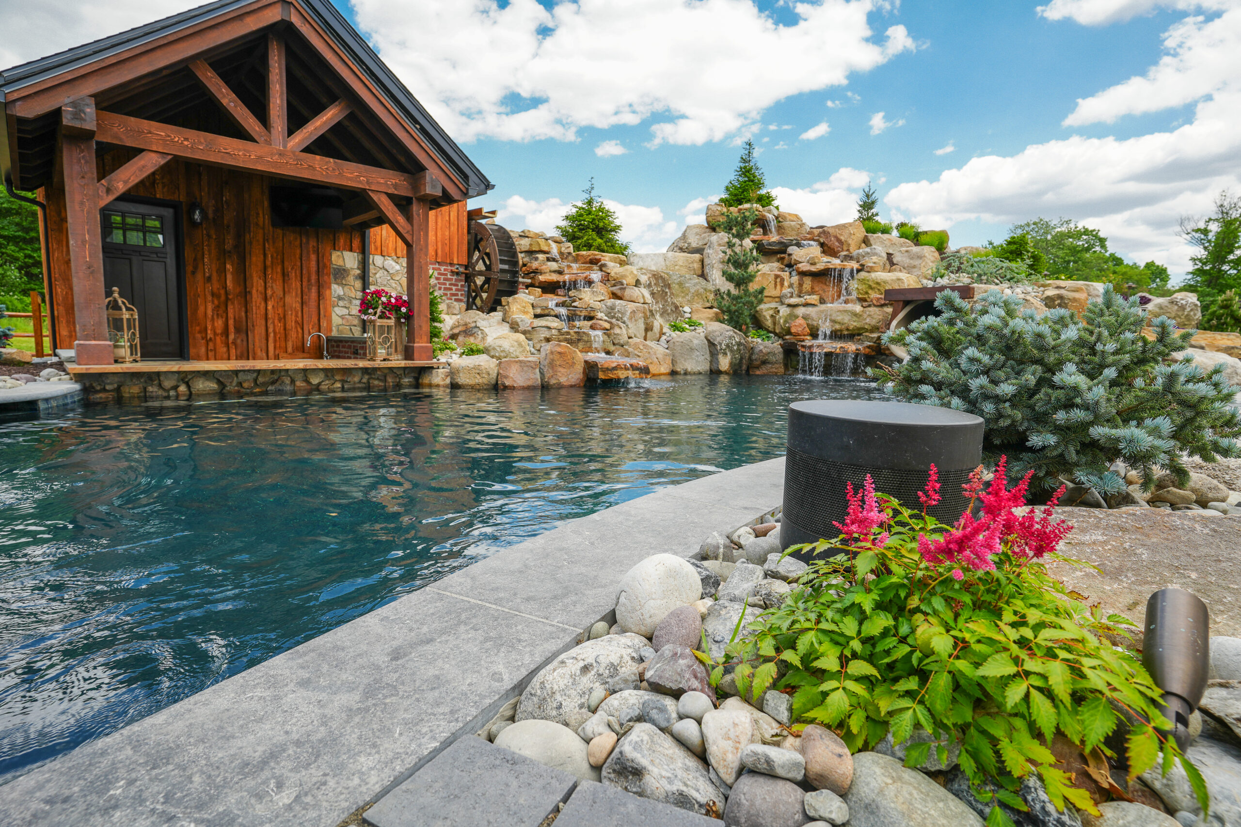 swim up bar, custom pool, waterfalls
