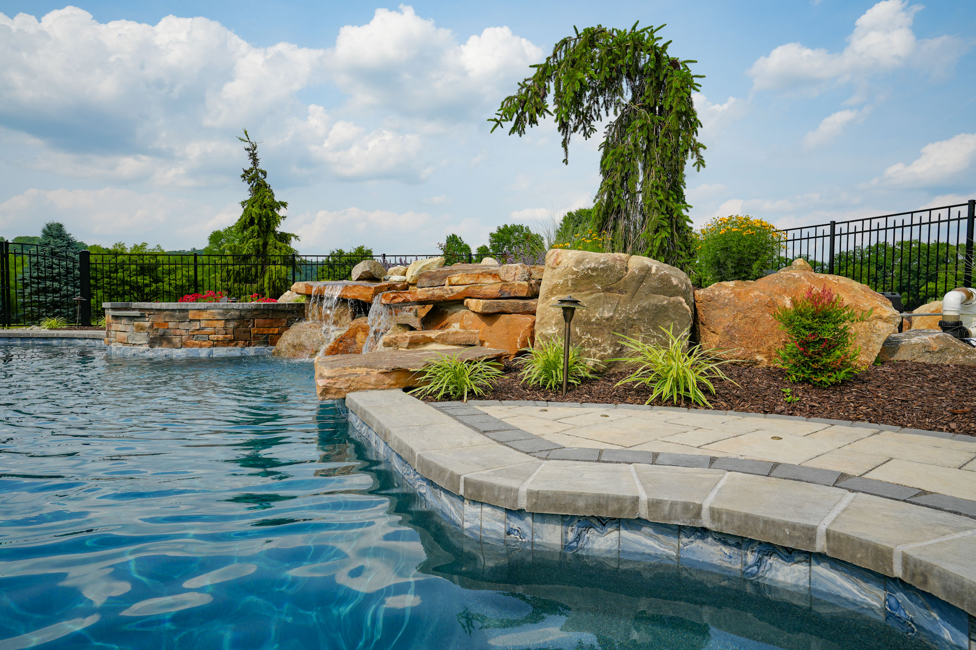 custom pool and spa with water feature