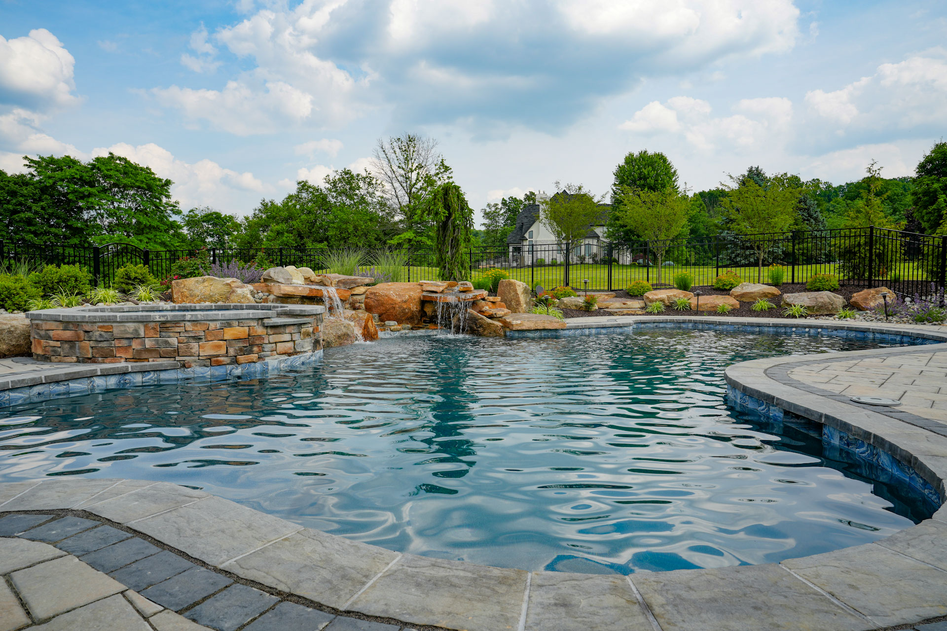custom pool and spa with water feature