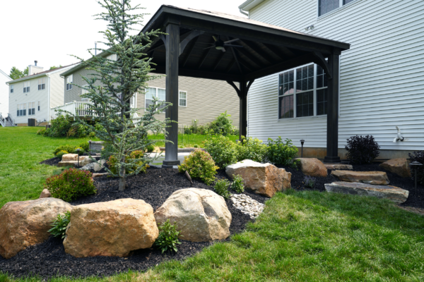 Custom pavilion and landscaping with natural boulders in the Lehigh Valley, PA